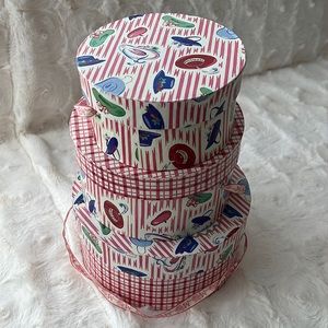 Stacked Muffy’s teddy bear hat boxes